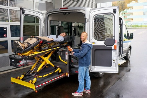 brooklyn resident being transfered in a private ambulance on a stretcher